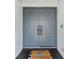 Elegant double front door with a decorative welcome mat adding a touch of warmth to the home's entry at 8638 Chadwick Dr, Tampa, FL 33635