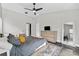 Bright main bedroom with a vaulted ceiling, natural light, and wood-look flooring at 8638 Chadwick Dr, Tampa, FL 33635