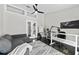 Cozy office space features a modern desk and a comfortable seating area with a sofa at 8638 Chadwick Dr, Tampa, FL 33635