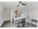 This modern office features a bright white desk and contemporary lighting at 8638 Chadwick Dr, Tampa, FL 33635