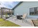 Cozy patio space with outdoor seating for relaxation and enjoying the peaceful surroundings of the home's exterior at 8638 Chadwick Dr, Tampa, FL 33635
