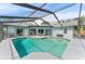 A stunning in-ground pool with a screened-in enclosure, providing a private and refreshing escape in a well-maintained backyard at 8638 Chadwick Dr, Tampa, FL 33635