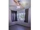 Bedroom featuring a ceiling fan and a window with dark curtains at 910 Robinson N Dr, St Petersburg, FL 33710