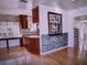 Well-designed kitchen with custom cabinetry and granite countertops and stone backsplash at 910 Robinson N Dr, St Petersburg, FL 33710