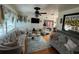 Inviting living room featuring elegant sofas, hardwood floors, and lots of natural light at 910 Robinson N Dr, St Petersburg, FL 33710
