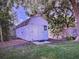 Backyard shed surrounded by mature trees at 910 Robinson N Dr, St Petersburg, FL 33710
