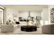 Bright and airy living room and kitchen featuring an open-concept design with modern finishes at 9558 Runaway Breeze Dr, Land O Lakes, FL 34637