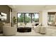 Bright living room with a large window overlooking the backyard and an adjacent dining area at 9558 Runaway Breeze Dr, Land O Lakes, FL 34637