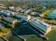 Breathtaking aerial of the complex on a sunny day, showcasing the building's layout and beautiful coastal setting at 100 Bluff View Dr # 514C, Belleair Bluffs, FL 33770