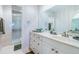 Bright bathroom featuring a vanity with drawers and a glass-enclosed shower at 100 Bluff View Dr # 514C, Belleair Bluffs, FL 33770