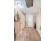 Inviting entryway featuring patterned wallpaper, neutral tile flooring, and ample closet space at 100 Bluff View Dr # 514C, Belleair Bluffs, FL 33770
