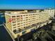 Exterior view of a multi-story condo building with balconies and water views at 100 Bluff View Dr # 514C, Belleair Bluffs, FL 33770