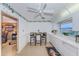 This eat-in kitchen features a quaint table, wainscoting, and ample countertop space at 100 Bluff View Dr # 514C, Belleair Bluffs, FL 33770