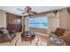 Living room features large window with waterfront view, stylish decor, and neutral paint at 100 Bluff View Dr # 514C, Belleair Bluffs, FL 33770