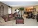 Spacious living room with couches, coffee table, decor and view of adjacent dining space at 100 Bluff View Dr # 514C, Belleair Bluffs, FL 33770