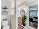 Hallway to a stylish bathroom with dual sinks and a modern shower, and a cozy bedroom view at 1014 Sylvia Ln, Tampa, FL 33613