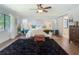 Inviting bedroom featuring a ceiling fan, bright natural light, and a cozy decor at 1014 Sylvia Ln, Tampa, FL 33613