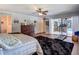 Spacious bedroom with a view of the patio, a ceiling fan, and hardwood floors at 1014 Sylvia Ln, Tampa, FL 33613