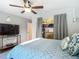Relaxing bedroom featuring a ceiling fan, closet, and TV at 1014 Sylvia Ln, Tampa, FL 33613