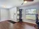Entrance area with front door, storage and multiple artistic decorations at 1014 Sylvia Ln, Tampa, FL 33613