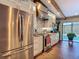 Beautiful kitchen boasts stainless steel appliances and a view of the pool at 1014 Sylvia Ln, Tampa, FL 33613