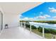 Gorgeous condo balcony with beautiful water views and modern glass railings at 1020 Sunset Point Rd # 410, Clearwater, FL 33756
