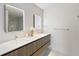 Modern bathroom featuring double sinks, sleek vanities, and illuminated mirrors at 1020 Sunset Point Rd # 410, Clearwater, FL 33756