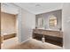 Modern bathroom with stone counter, double mirrors and a relaxing shower room at 1020 Sunset Point Rd # 410, Clearwater, FL 33756