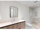 Bright bathroom showcasing a modern vanity and glass-enclosed shower at 1020 Sunset Point Rd # 410, Clearwater, FL 33756