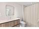Bathroom showcasing a modern vanity and shower with a curtain at 1020 Sunset Point Rd # 410, Clearwater, FL 33756