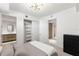 Stylish bedroom featuring closet doors with a connecting bathroom at 1020 Sunset Point Rd # 410, Clearwater, FL 33756