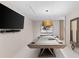 A stunning game room featuring a pool table, mounted TV and modern lighting at 1020 Sunset Point Rd # 410, Clearwater, FL 33756