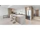 Modern kitchen featuring a large island with seating, stainless steel appliances, and sleek cabinets at 1020 Sunset Point Rd # 410, Clearwater, FL 33756