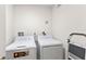 Laundry room with a washer and dryer at 1020 Sunset Point Rd # 410, Clearwater, FL 33756