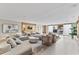 Spacious living room with modern decor, neutral color palette, and an open layout for seamless entertaining at 1020 Sunset Point Rd # 410, Clearwater, FL 33756