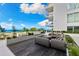 Beautiful condo patio with outdoor lounge, fire pit, and scenic city views at 1020 Sunset Point Rd # 410, Clearwater, FL 33756