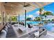 Luxury resort-style pool with ample seating and shady cabanas by the ocean at 1020 Sunset Point Rd # 410, Clearwater, FL 33756