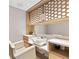 Styling room with a sink, mirror and comfortable white chair at 1020 Sunset Point Rd # 410, Clearwater, FL 33756