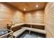 Wooden sauna with multiple seating levels and sauna equipment at 1020 Sunset Point Rd # 410, Clearwater, FL 33756