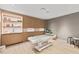 Modern spa room with a massage table, wood cabinets and sleek sink at 1020 Sunset Point Rd # 410, Clearwater, FL 33756