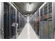 Hallway of metal storage units under fluorescent lighting at 1020 Sunset Point Rd # 410, Clearwater, FL 33756