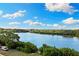 Breathtaking water views from the residence showing sparkling water and lush greenery at 1020 Sunset Point Rd # 410, Clearwater, FL 33756
