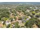 A long distance aerial view showing this home's ideal location in a peaceful, established neighborhood at 10306 Shalimar Wood Dr, Thonotosassa, FL 33592