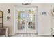 Elegant glass patio doors leading to an outdoor dining area and showcasing natural light at 10306 Shalimar Wood Dr, Thonotosassa, FL 33592