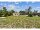 The backyard features a lanai, mature trees and plenty of space for outdoor enjoyment at 10306 Shalimar Wood Dr, Thonotosassa, FL 33592