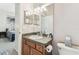 Bathroom featuring a vanity with granite countertops and a stylish mirror with view into another room at 10306 Shalimar Wood Dr, Thonotosassa, FL 33592