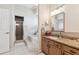 Bathroom featuring a large tub with tile surround and a glass-enclosed shower at 10306 Shalimar Wood Dr, Thonotosassa, FL 33592