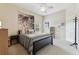 Cozy bedroom with a large bed, neutral tones, and natural light, creating a serene and inviting atmosphere at 10306 Shalimar Wood Dr, Thonotosassa, FL 33592