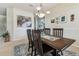 The dining room has a table with seating for four in an open floor plan at 10306 Shalimar Wood Dr, Thonotosassa, FL 33592