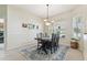 Dining room features a table with seating for four and natural light at 10306 Shalimar Wood Dr, Thonotosassa, FL 33592
